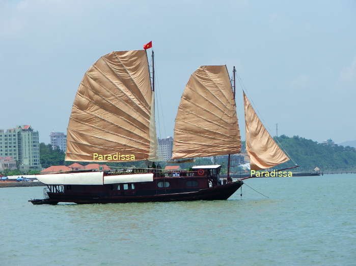 A wooden boutique luxury sail boat with traditional design on Halong Bay